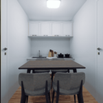 Petit bureau modulaire avec table à manger en bois foncé, quatre chaises gris clair, plan de travail avec évier, armoires blanches au-dessus du plan de travail, divers éléments de cuisine, murs et plafond blancs, sol en bois, luminaire fixé au plafond.